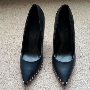 Black studded leather pumps